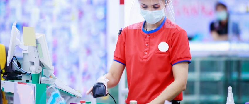 Shop assistant wears mask, illustrative picture