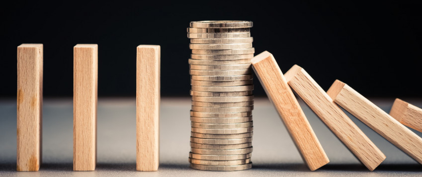 Pile of coins and falling dominos, illustration