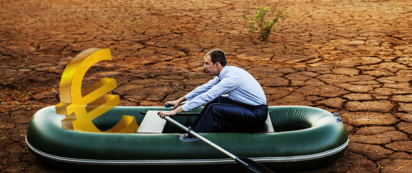 Man in a boat with money, illustrative picture