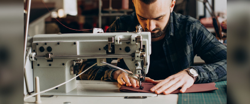 Illustrative photo men sewing