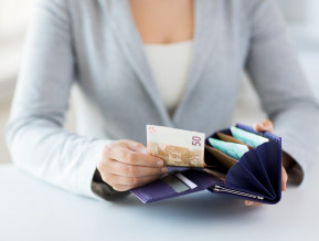 Female counting money, illustrative picture