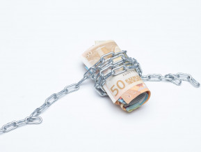 Banknotes in chains, illustrative picture