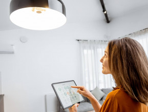 Illustrative woman switching light lower