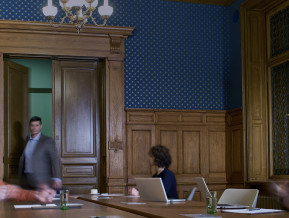 Illustrative photo of people in a meeting room